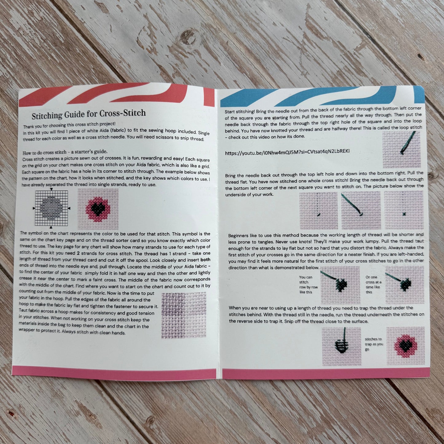 Open book with text and patterns on a wooden surface