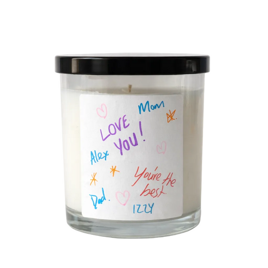 Candle with a hand-written message on a white background