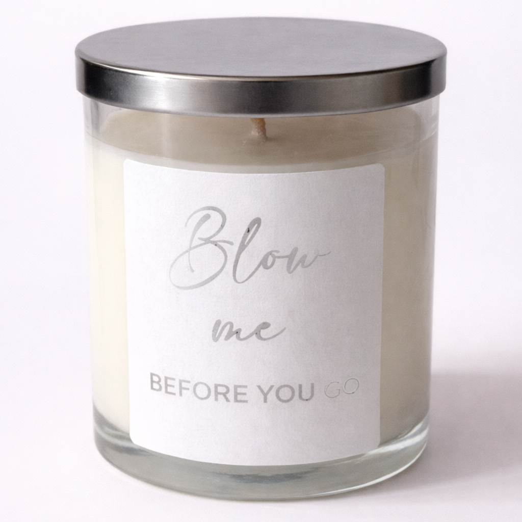 Candle with a silver lid and white label on a white background
