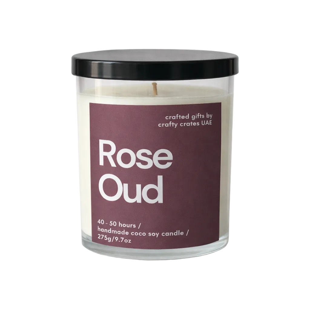 Candle with a purple label reading 'Rose Oud' on a white background
