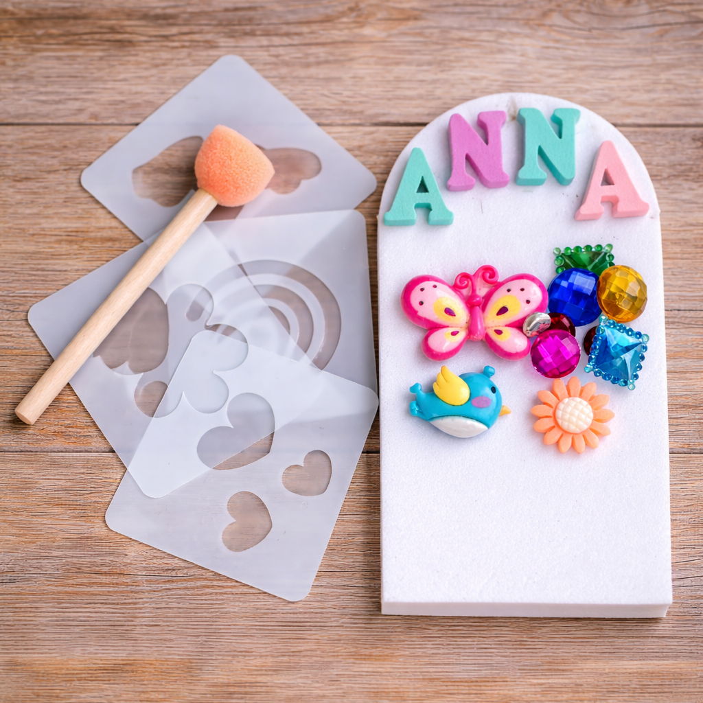 Decorative nameplate with colorful letters and stickers on a wooden surface, accompanied by a mold and tools.