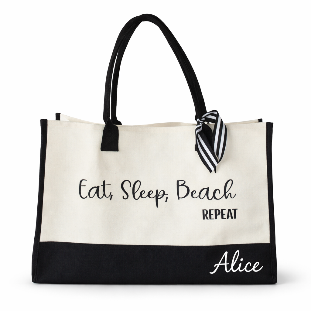 Beige tote bag with black text and trim, featuring a striped bow, on a white background.