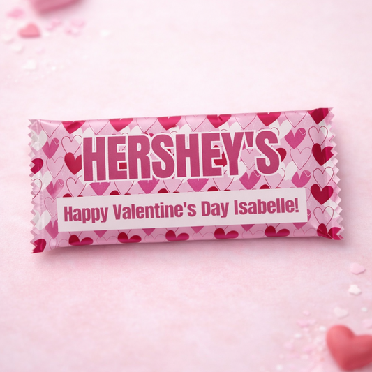 Personalized Hershey's chocolate bar with Valentine's Day message on a pink background