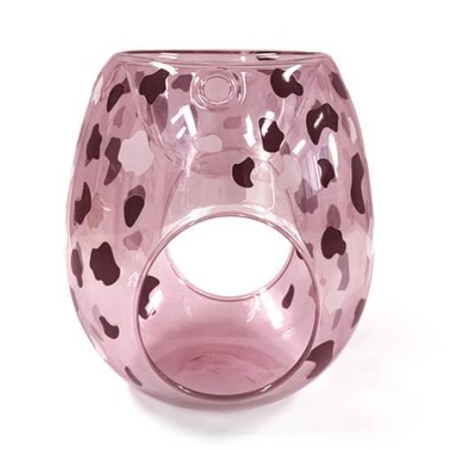Pink glass candle holder with leopard print pattern on a white background