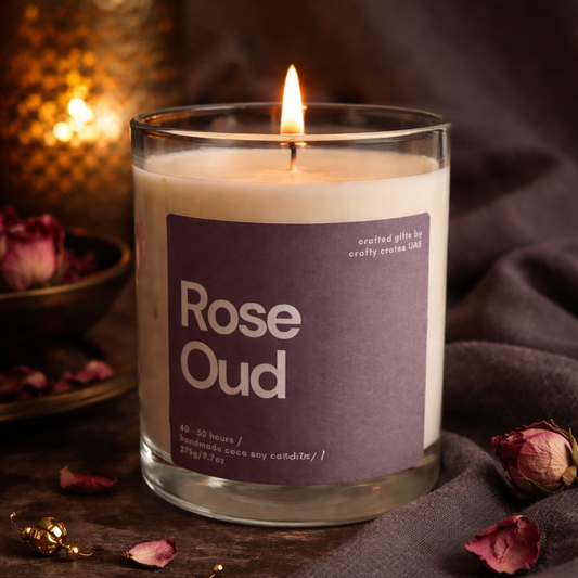 Candle labeled 'Rose Oud' with a purple label on a dark background
