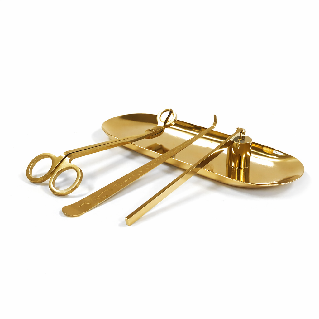 Set of gold-colored medical tools including scissors and tweezers on a white background