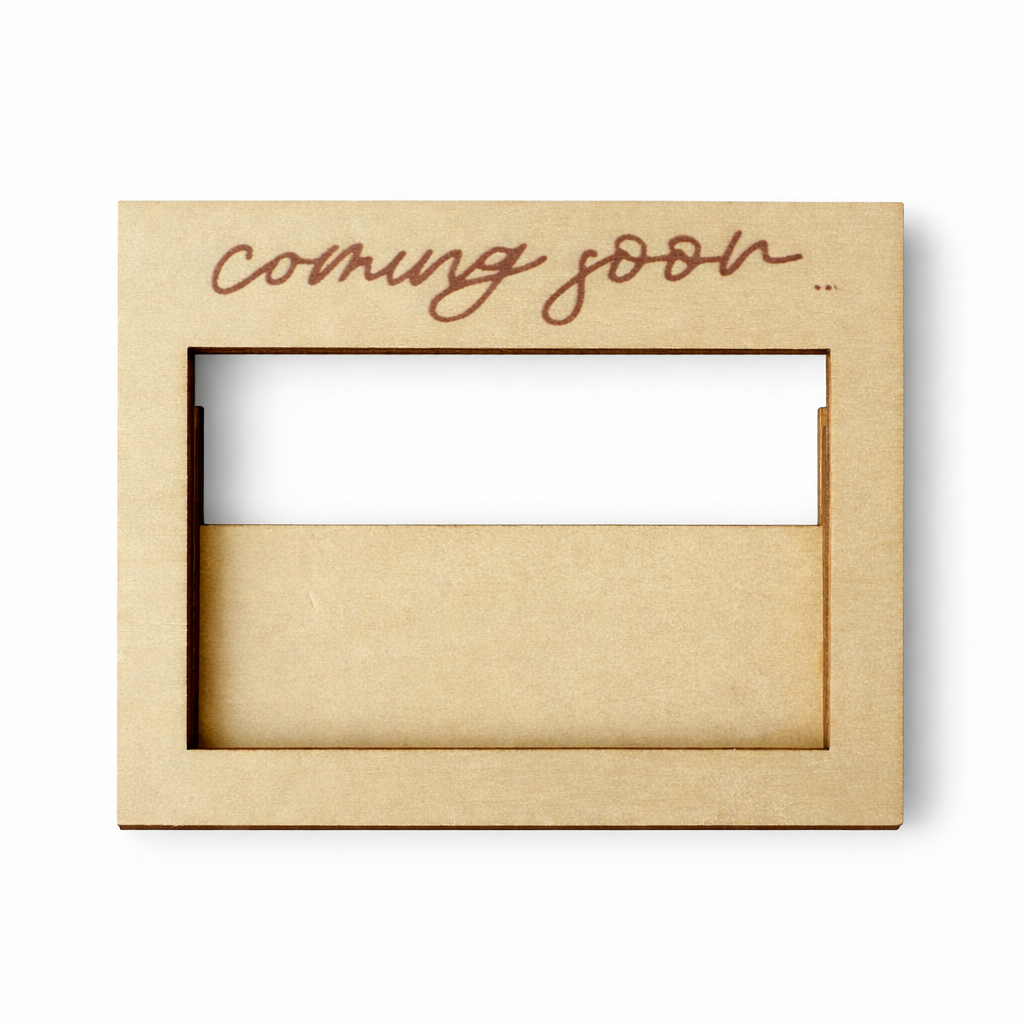 Wooden box with 'coming soon' text on a white background