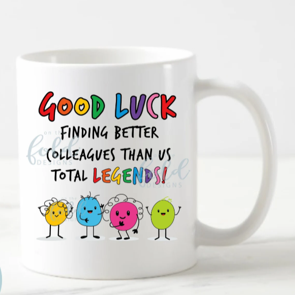 White mug with colorful text and cartoon characters on a white background