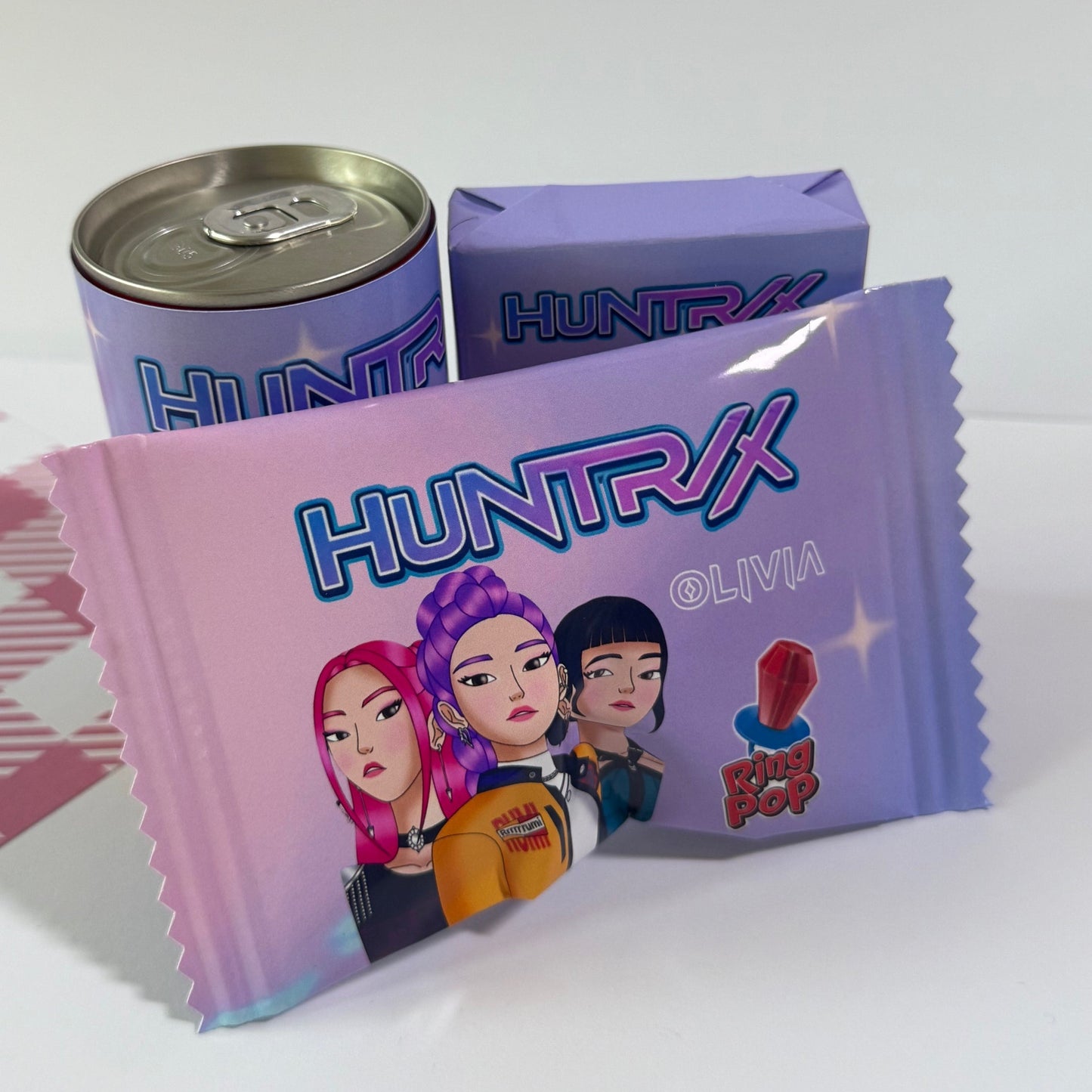 Huntrix candy packaging with cartoon characters on a white background