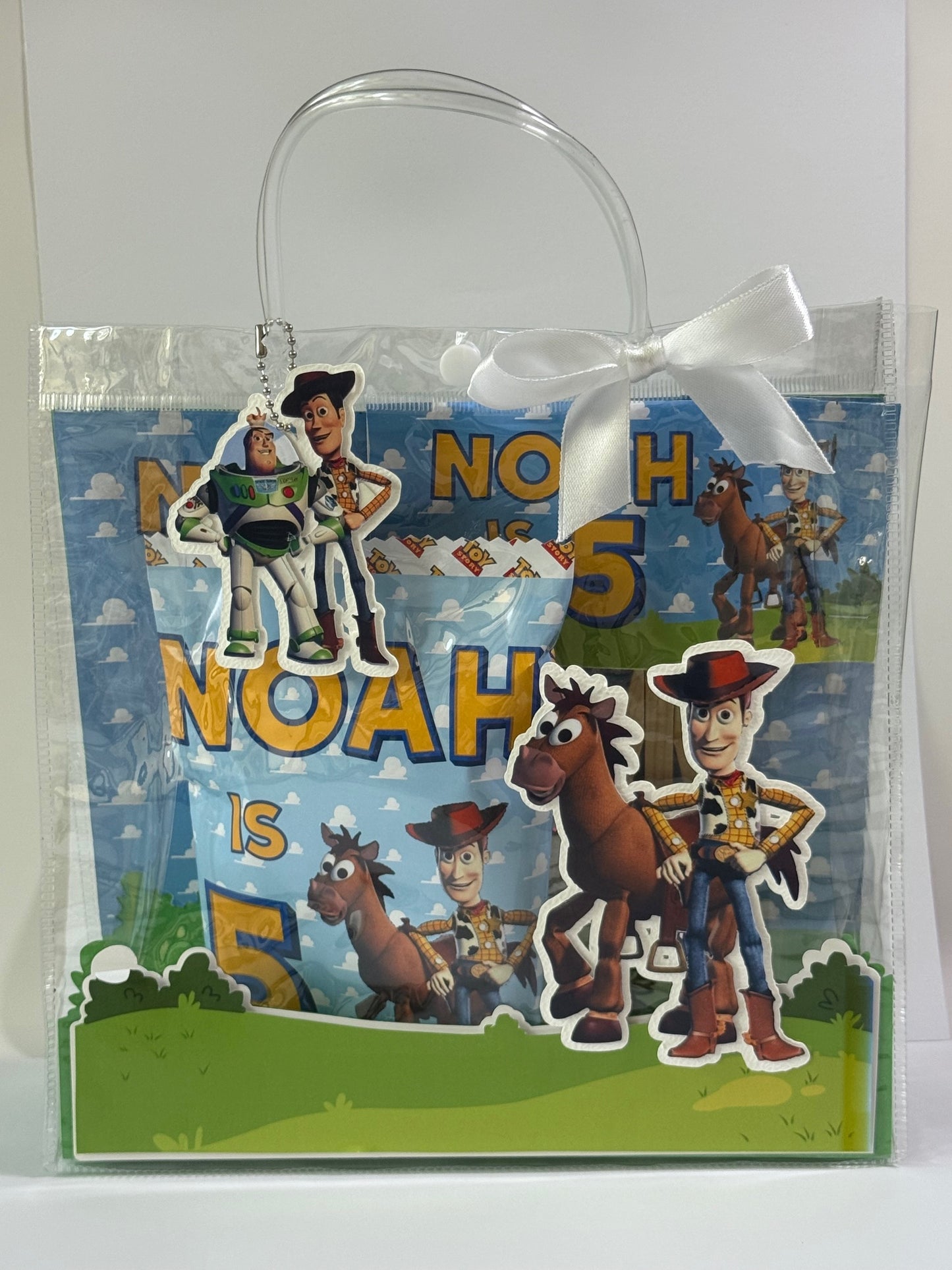 Party favor bag with 'Toy Story' characters and 'Noah is 5' text on a white background