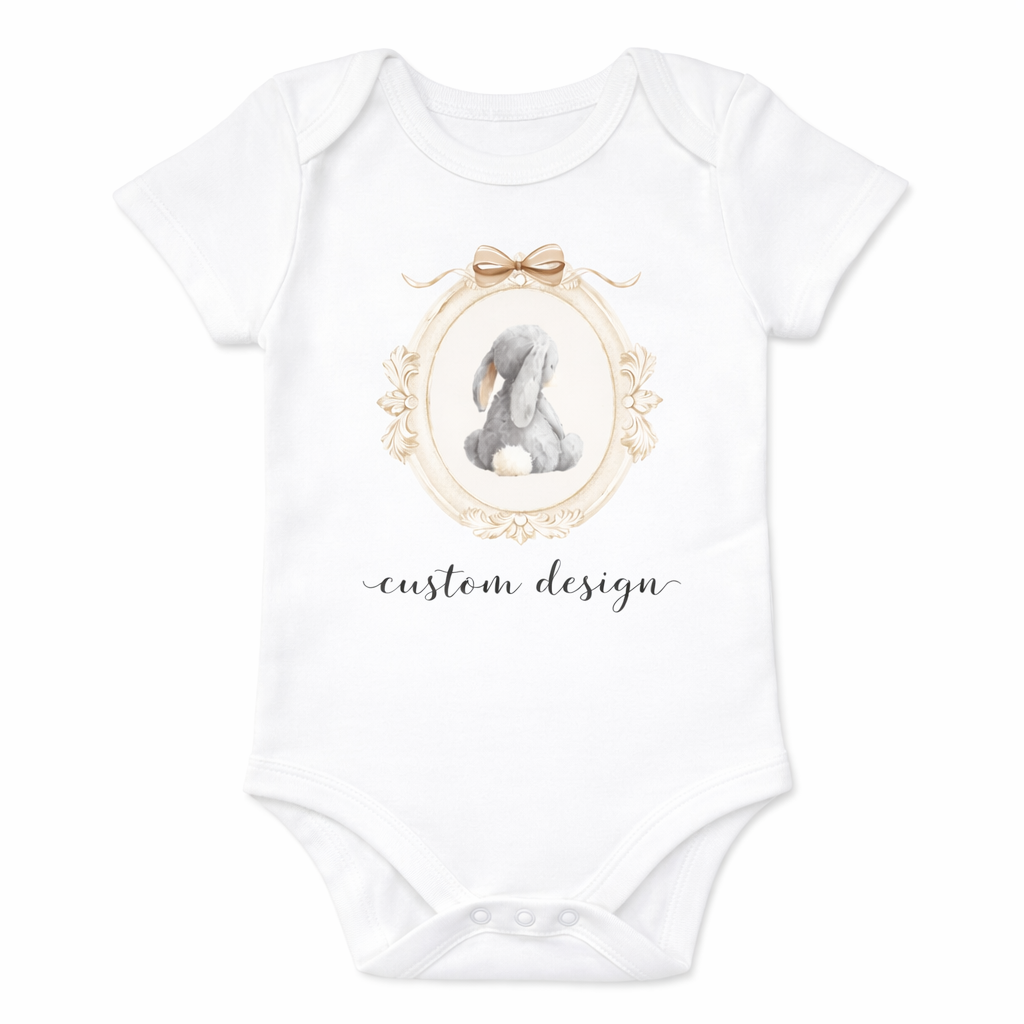 White baby onesie with a custom design of a poodle in a frame on a white background