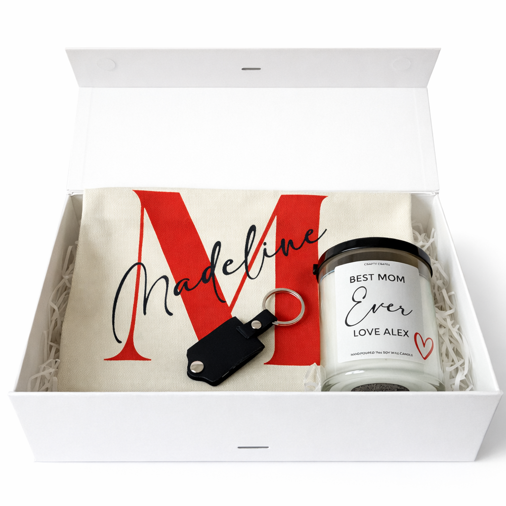 Gift set with a mug, keychain, and personalized candle in a box.