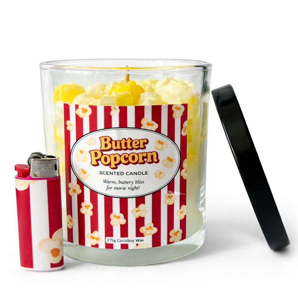Butter Popcorn scented candle with striped label and two lighters on a white background