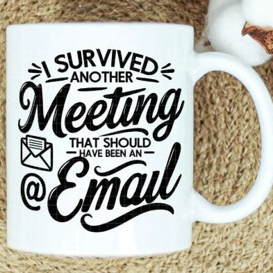 White mug with black text 'I survived another meeting that should have been an email' on a textured surface.